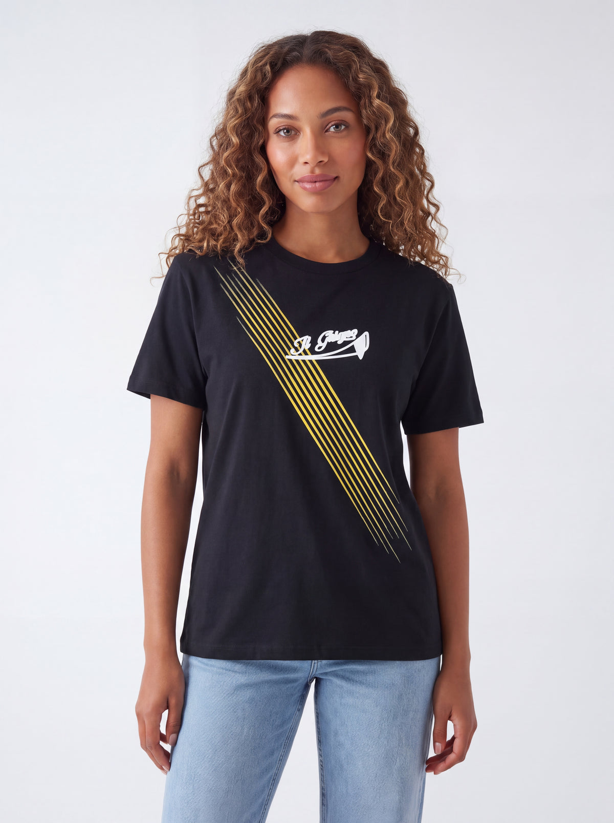 Female model wearing Il Ghigno Drop 0 black organic cotton t-shirt with Gold Sun print